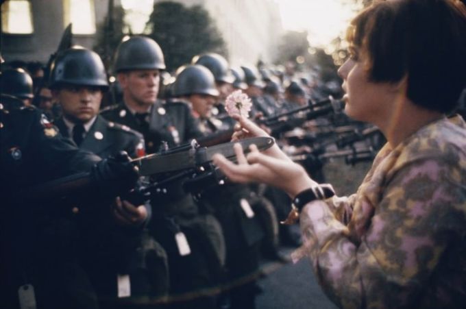 War and Peace: 17 year old Jan Rose Kasmir offers a flower to soldiers during the Pentagon anti-war protest in 1967.